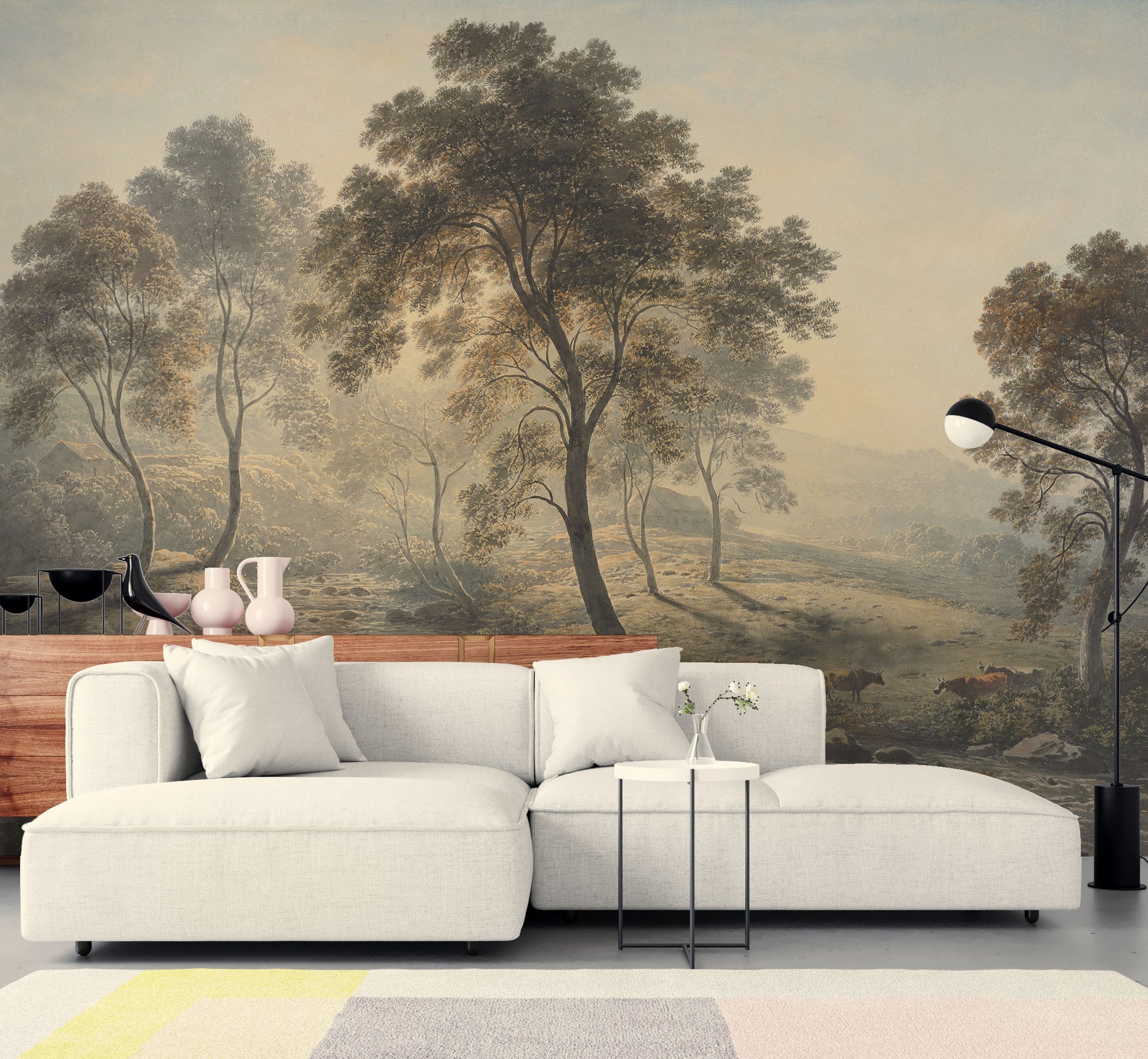 Modern living room with a scenic wall mural.