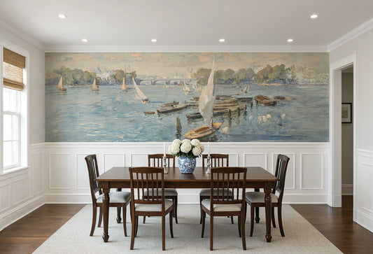 Coastal sailboat wall mural installed above white wainscoting in a dining room