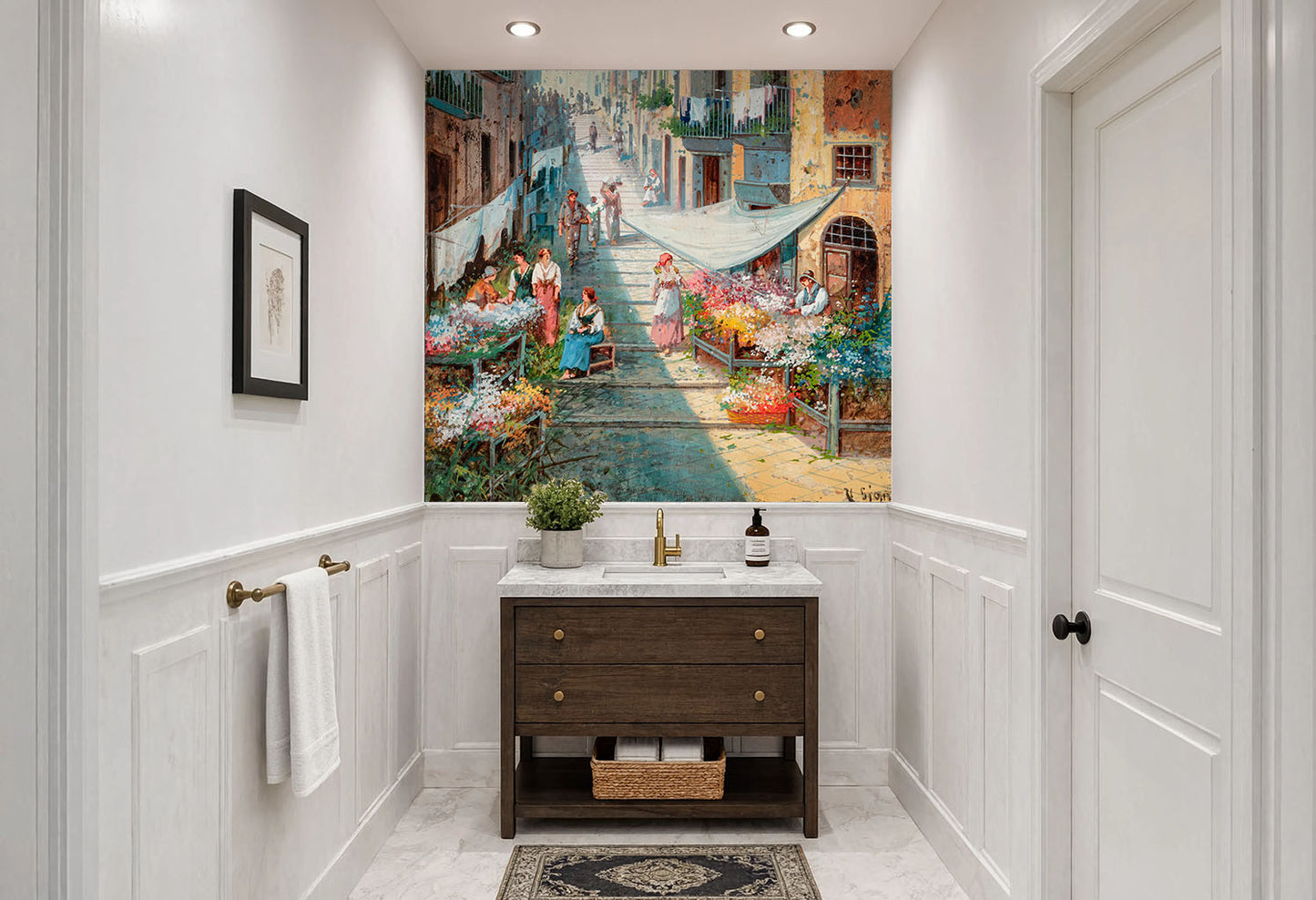 Fine art Mediterranean village print wallpaper on laminated vinyl showing colorful flower carts, hanging laundry, and sunlit alleyway architecture.