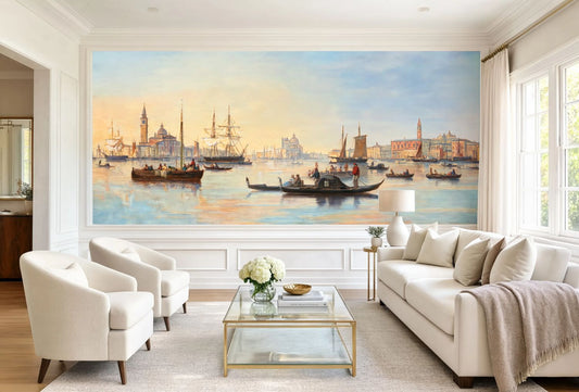 A wide panoramic wall mural depicting Josef Püttner's 1873 painting of the Venice lagoon with sailboats and gondolas at sunset installed in a modern white living room.