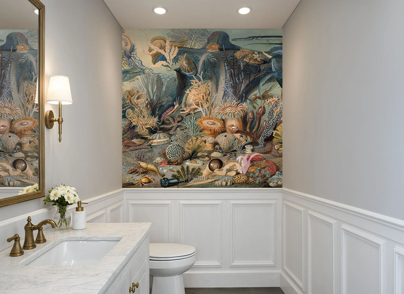 Water-resistant marine biology wallpaper featuring coral and starfish behind a bathroom vanity mirror
