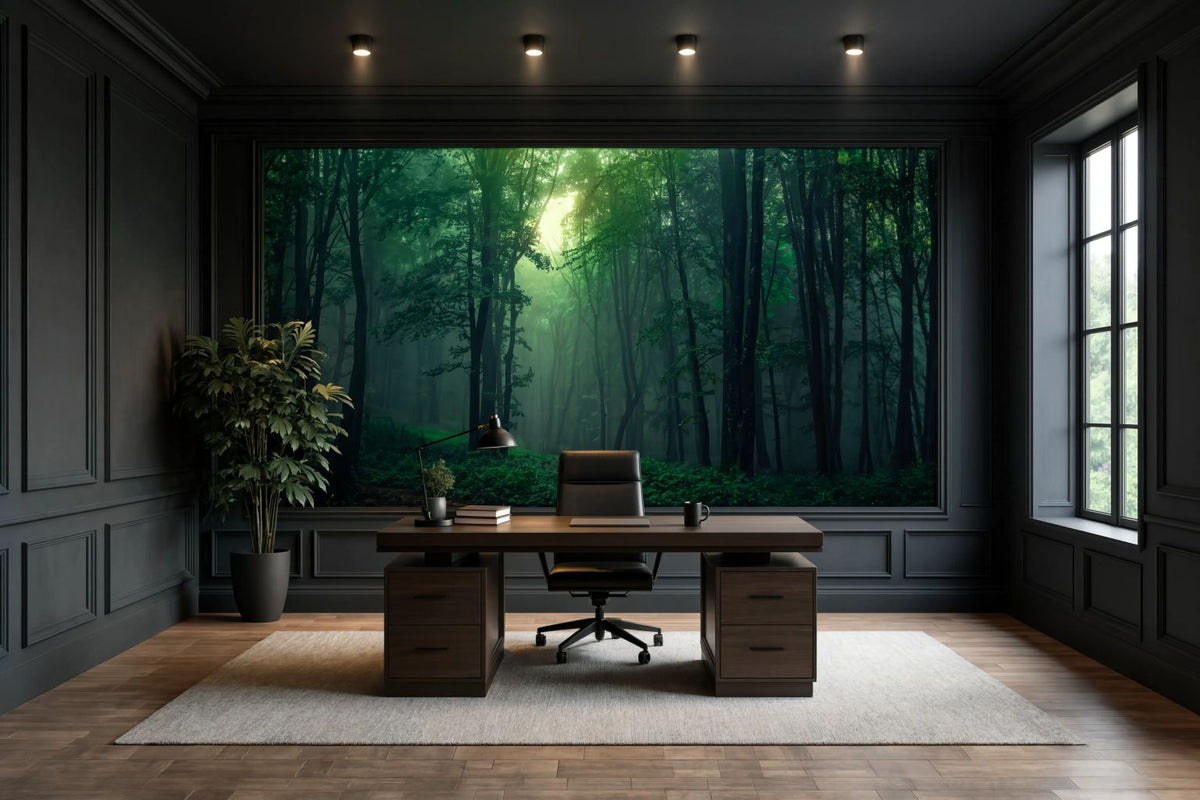 A large wall mural depicting a sunlit green forest, displayed in a modern home office setting with a dark wood desk, office chair, and dark paneled walls.
