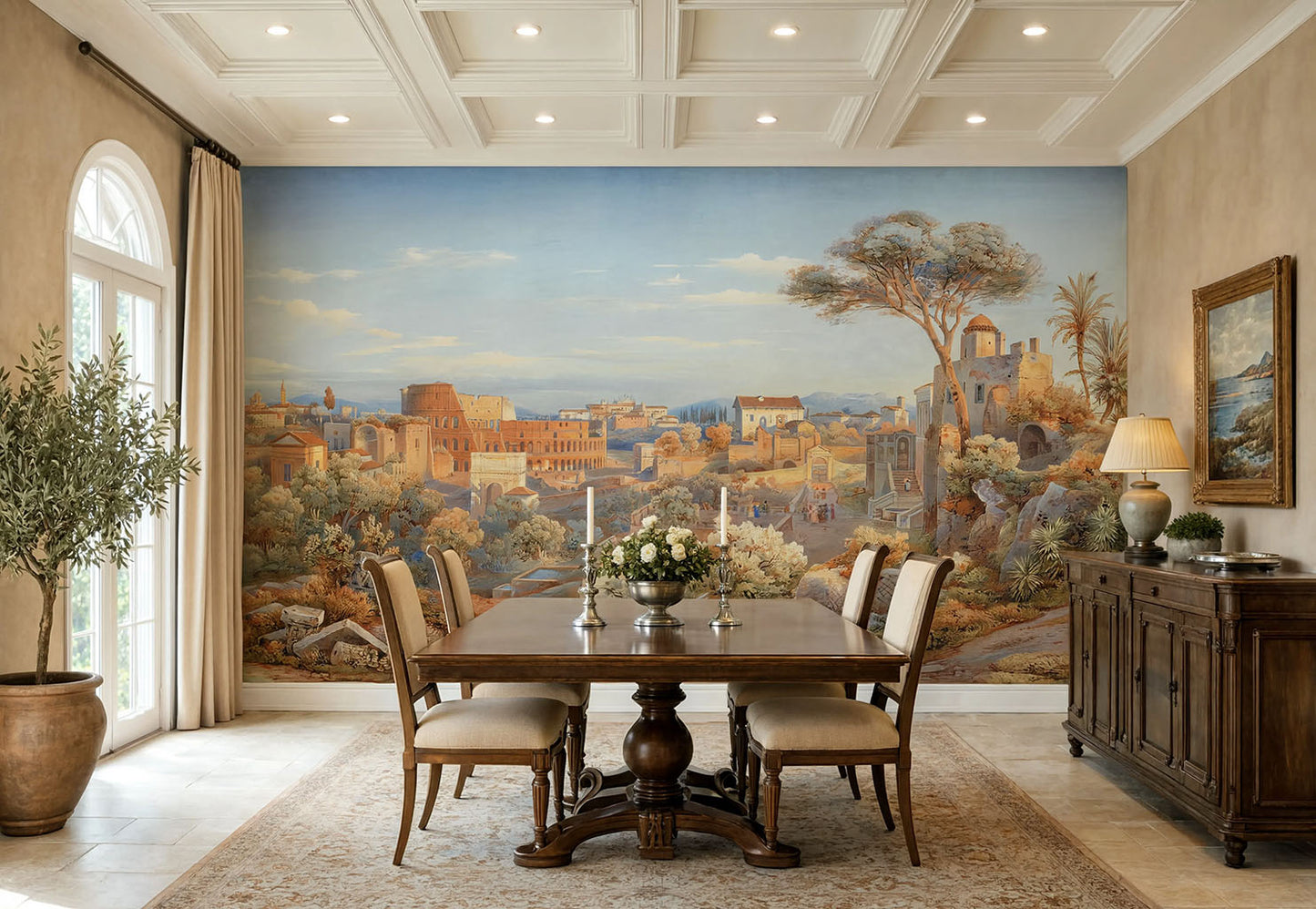 A large wall mural depicting a classical landscape city scene with trees, ruins, and a blue sky, shown in a styled dining room with a wooden table, chairs, sideboard, and arched window.