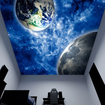 A ceiling mural depicting a deep blue outer space scene with Earth, the Moon, and stars, installed in a home office or gaming room above a desk and chair.