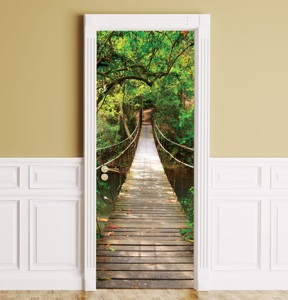 A wooden suspension bridge over a lush green forest mural, shown installed on a beige wall with white wainscoting.