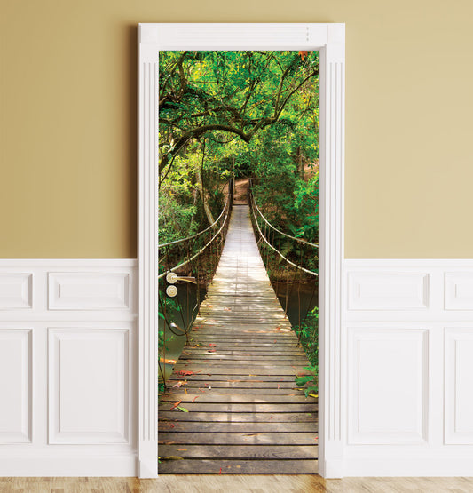 A wooden suspension bridge over a lush green forest mural, shown installed on a beige wall with white wainscoting.