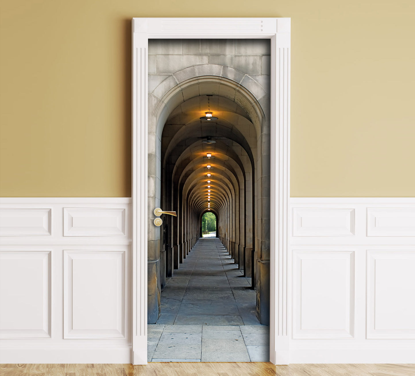 A wall mural depicting a stone arch corridor tunnel, shown installed in a room with beige upper walls, white wainscoting, and a wood floor.