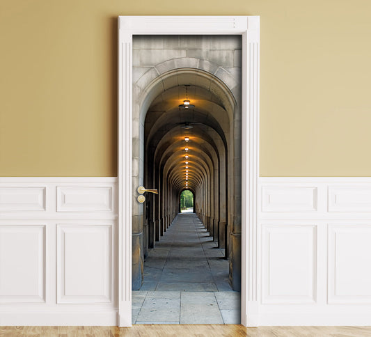 A wall mural depicting a stone arch corridor tunnel, shown installed in a room with beige upper walls, white wainscoting, and a wood floor.