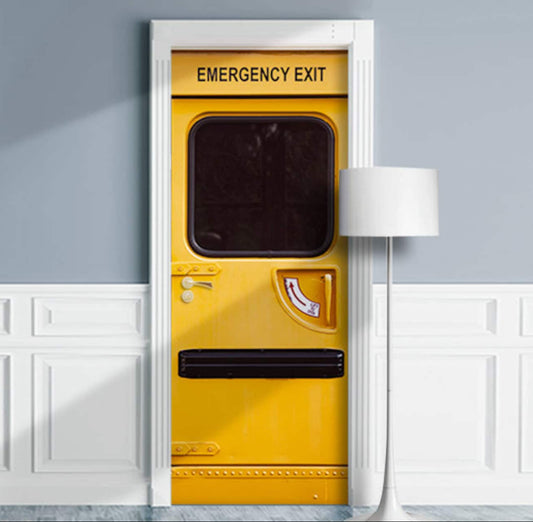 Yellow emergency exit door with black text on a gray wall.