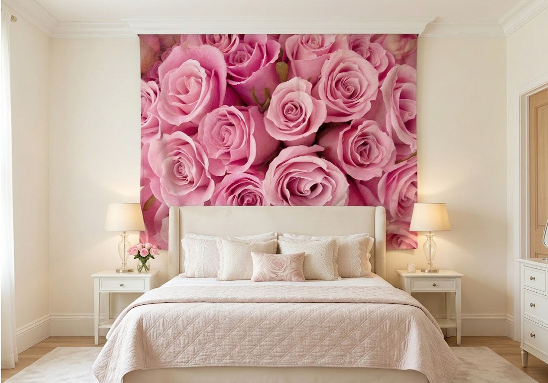 Soft pink roses fabric wallcovering hung as an accent piece above a bed frame.
