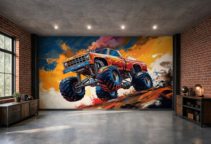A large wall mural featuring a red and blue monster truck jumping over rocks, displayed on a brick-walled wall in a modern industrial room with concrete floors and brick walls.