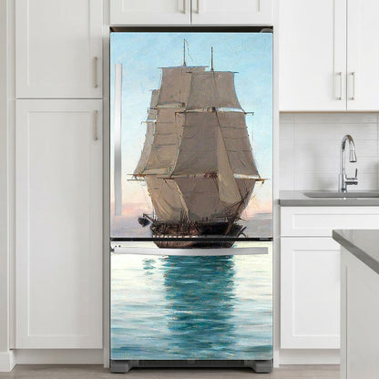 Fridge with a decorative decal of a sailboat
