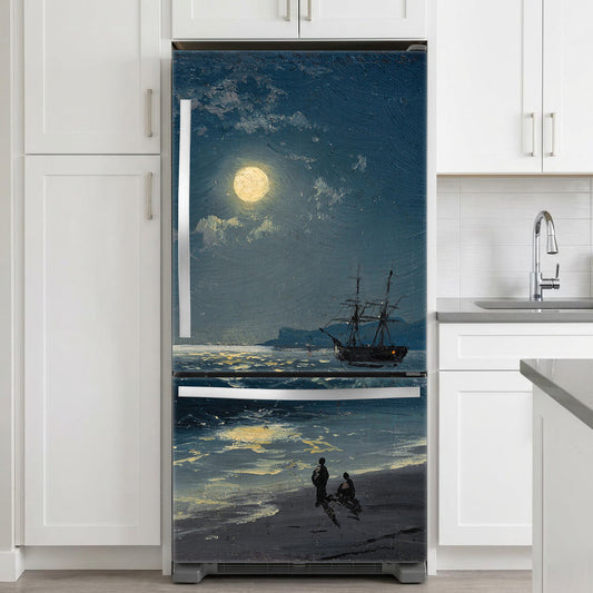 Fridge with a decorative decal of a ship on a moonlit sea in a kitchen.