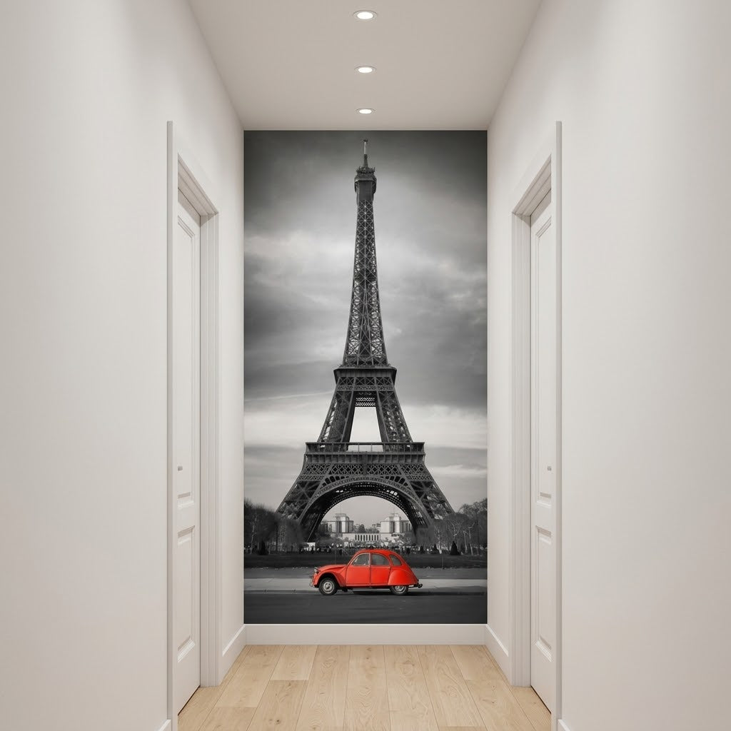 Ideas for hallway decor. A large wall mural depicting the Eiffel Tower in Paris with a small red car at the bottom, displayed on a hallway wall above light wood flooring.