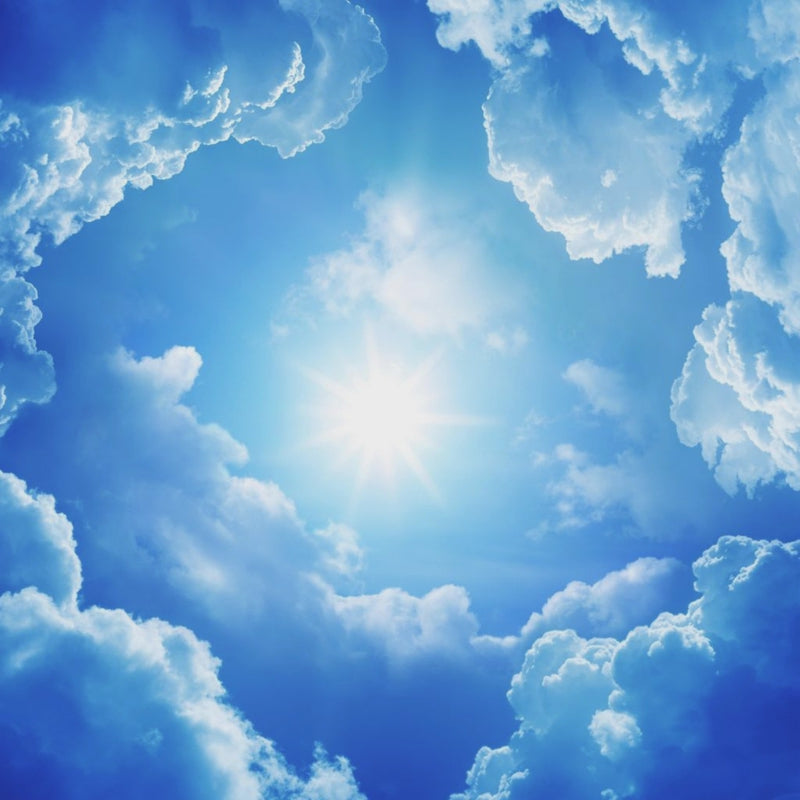 Close-up view of skylight effect peel and stick ceiling wallpaper with realistic clouds.