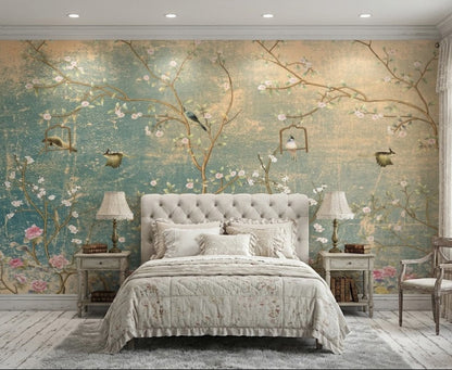 A styled bedroom featuring a large wall mural with a vintage-style floral and bird design in soft teal, beige, and pink tones.