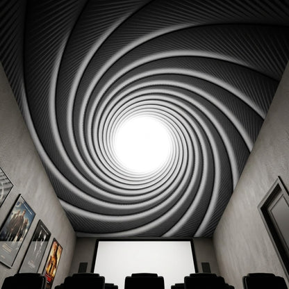 A movie theater or home theater interior with rows of dark seats facing a bright screen, looking upward at a ceiling designed to resemble the gun barrel spiral in black, gray, and white.