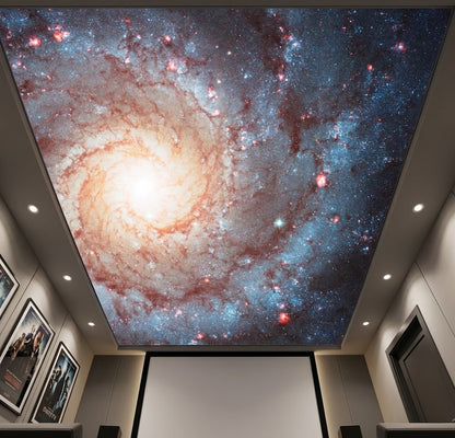Home theater ceiling featuring a spiral galaxy mural centered around a chandelier light.