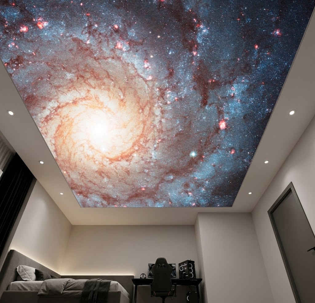 Bedroom ceiling styled with a mesmerizing spiral galaxy wallcovering above the bed.